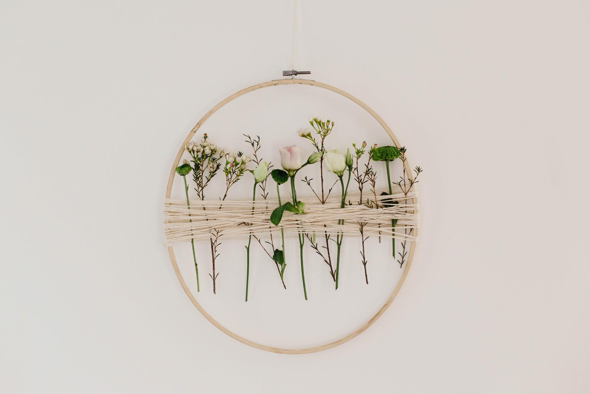 Circular embroidered patch with botanical motif