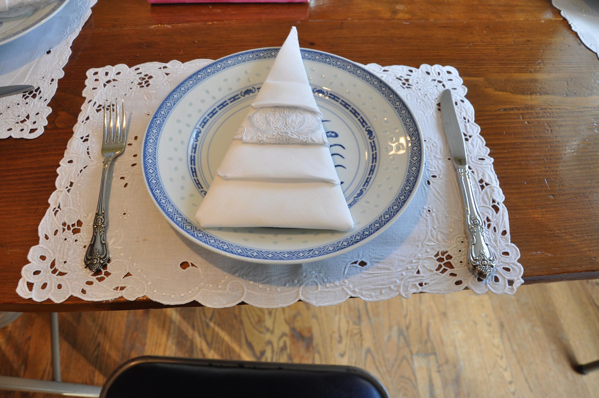 Hand-stitched linen napkin with border